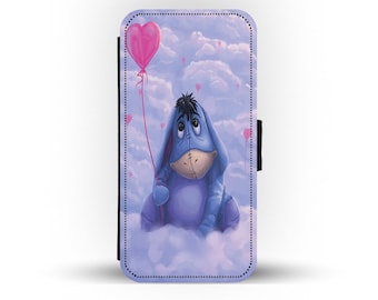 May include: A blue Eeyore character from Winnie the Pooh holding a pink heart-shaped balloon. The character is sitting on a cloud with a background of pink heart-shaped balloons and clouds.