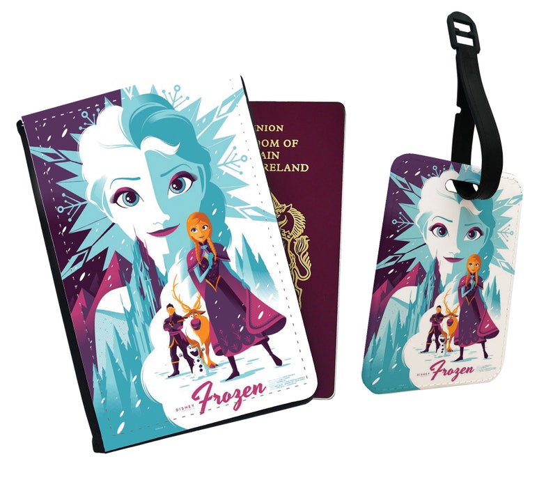 May include: A passport holder and luggage tag featuring a colorful illustration of Elsa and Anna from the Disney movie Frozen. The design includes a purple, blue, and white background with snowflakes and a mountain scene. The text "Frozen" is printed on both items.