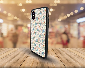 May include: A black phone case with a white background and a floral pattern in shades of blue, pink, and yellow.