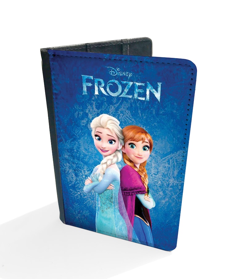 May include: A blue passport holder with a Disney Frozen design featuring Elsa and Anna. The text "Disney Frozen" is printed in white on the front.