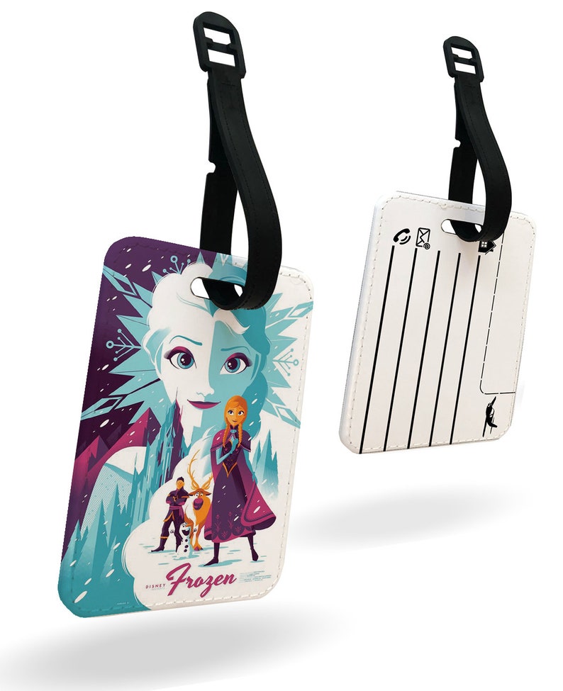 May include: White luggage tag with a colorful illustration of characters from the Disney movie Frozen. The tag has a black strap and a blank space for writing contact information. The text "Frozen" is printed on the tag.