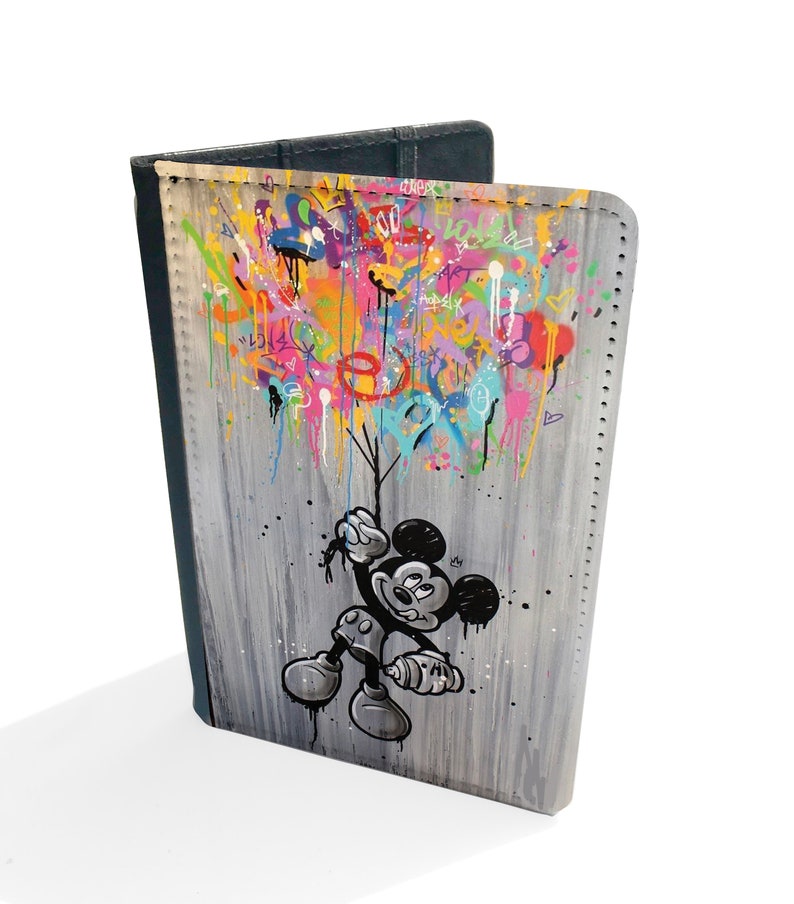 May include: A black and white illustration of Mickey Mouse holding a spray can, with colourful graffiti in the background. The illustration is on a grey and white canvas.