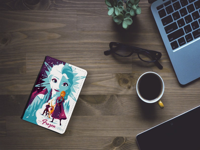 May include: A white and purple phone case with a colorful illustration of Elsa and Anna from the movie Frozen. The case features the text "Frozen" in pink.