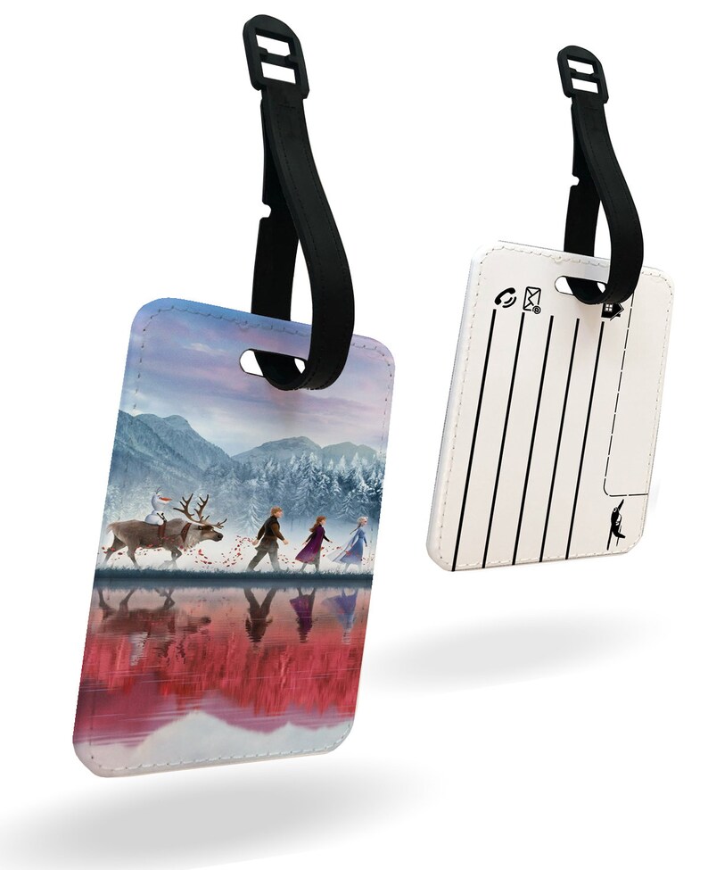 May include: A luggage tag with a colorful image of characters from the movie Frozen II. The tag has a black strap and a white back with lines for writing contact information.