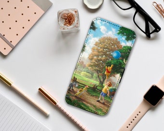 May include: A Winnie the Pooh phone case with a colorful illustration of Winnie the Pooh, Piglet, and a boy playing with a blue balloon in a green field with a large tree in the background.