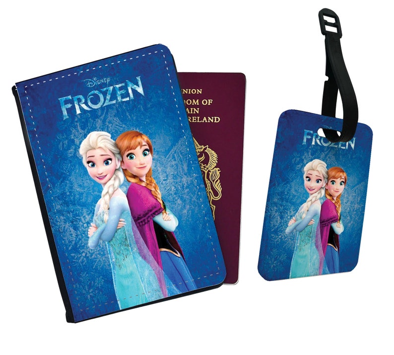 May include: A blue passport holder and luggage tag featuring Disney's Frozen characters, Elsa and Anna. The text "Disney Frozen" is printed on the passport holder.
