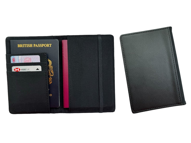 May include: Black leather passport holder with a built-in elastic strap and a separate pocket for cards. The holder is open to show a British passport, a credit card, and a burgundy passport.