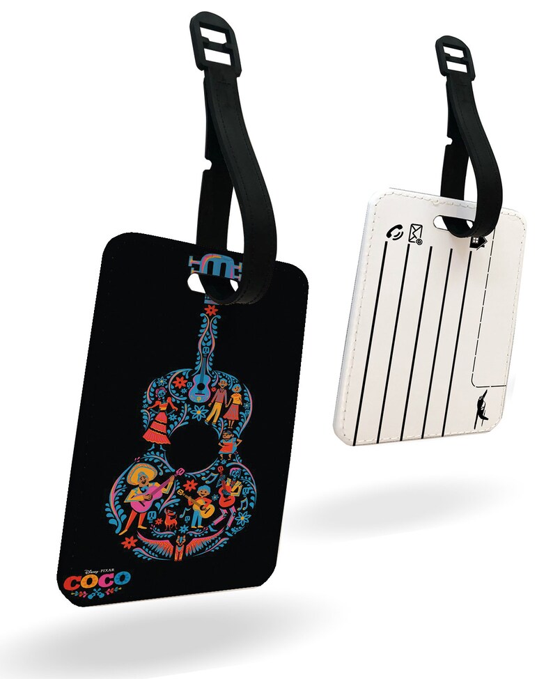 May include: Black luggage tag with a colorful guitar design featuring characters from the Disney Pixar movie Coco. The tag has a black strap with a buckle. The back of the tag is white with a blank space for writing.