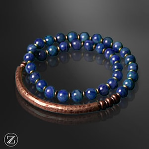 May include: A double-strand bracelet with blue gemstone beads and a hammered copper bar clasp.