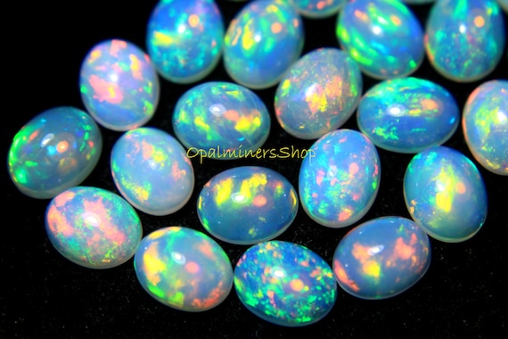 Natural Beautiful Ethiopian Welo Fire Opal Multi-Fire Oval Cabochon Gemstone . Natural Beautiful Ethiopian Welo Fire Opal Multi-Fire Oval Cabochon Gemstone .