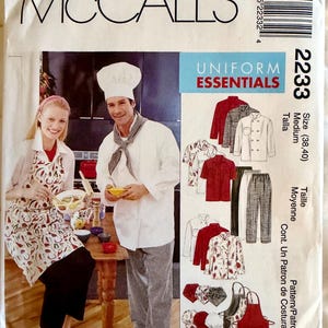 May include: McCall's 2233 sewing pattern envelope for Uniform Essentials, size Medium (38, 40). The front features illustrations of chef jackets, pants, aprons, and hats, with a photograph of two people wearing a chef hat, jacket, and apron.