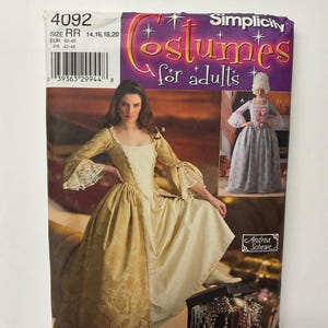 May include: A Simplicity sewing pattern envelope for costumes for adults, number 4092, size RR 14, 16, 18, 20. The cover features a gold gown with lace trim and a second costume option in light blue with a white wig, plus a jewellery box graphic.