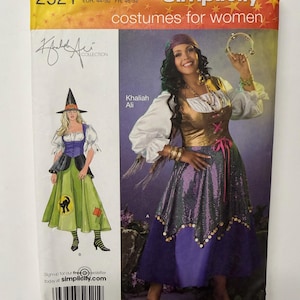 May include: A Simplicity sewing pattern envelope 2521 for costumes in size FF 18W-24W. The package features illustrations and photographs of a witch costume with a pointed hat and a gypsy-style outfit with a metallic bodice, sequined skirt, and tambourine.