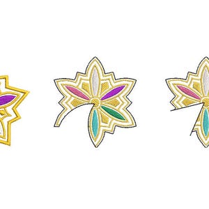 May include: Embroidered star-shaped design with a gold outline and colorful petals in blue, pink, purple, white, and teal. The design is repeated three times, with two showing partial cuts.