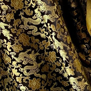 Satin black brocade fabric with Chinese golden dragon 46” wide price 1 yard
