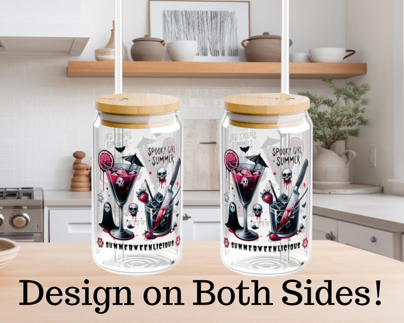 May include: Two glass tumblers with bamboo lids and straws. Each tumbler features a spooky cocktail design with skulls, a cocktail, and the text "SPOOKY GIRL SUMMER" and "SUMMERWEENLICIOUS". The design is on both sides.