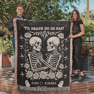 May include: Black woven blanket with a gothic design featuring two skeletons holding hands, surrounded by roses and bats. The text "'Til Death Do Us Part" is at the top, with "John & Emma Est. 2025" at the bottom. The blanket has a fringed edge.