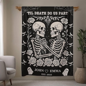 May include: Black blanket with a white skeleton couple design, surrounded by roses and bats. Text reads "'TIL DEATH DO US PART," with names "JOHN & EMMA" and the year "EST. 2025." Decorative, gothic-themed home decor.