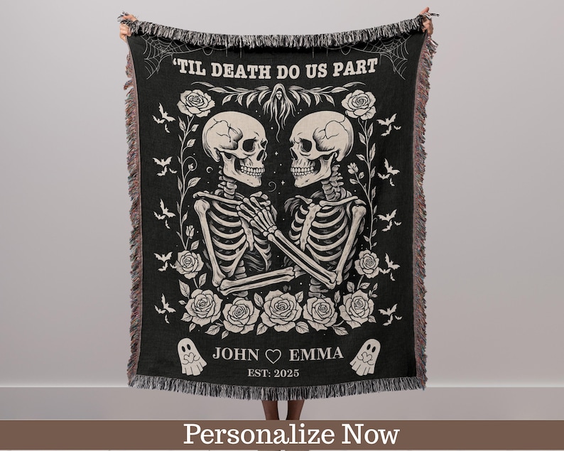 May include: Black woven throw blanket featuring a skeleton couple holding hands, surrounded by roses and bats. The text "'TIL DEATH DO US PART" is at the top. The names "JOHN ♡ EMMA" and the year "EST: 2025" are at the bottom.