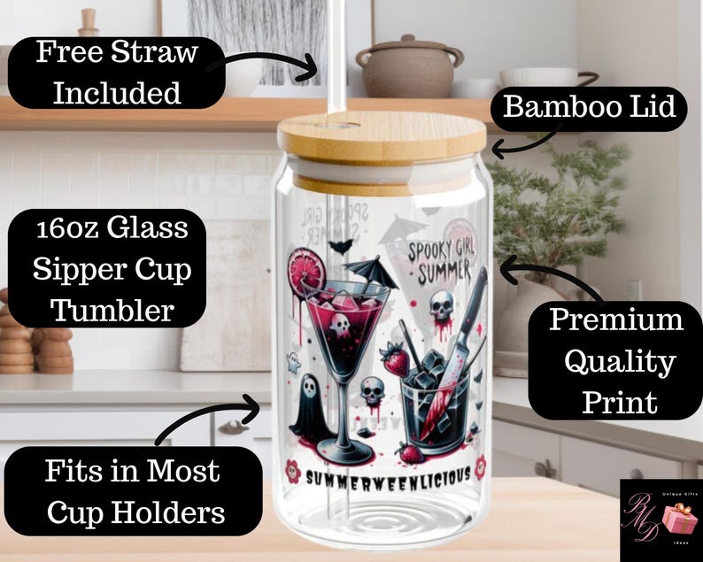May include: A clear 16oz glass sipper cup tumbler with a bamboo lid. The tumbler features a spooky summer design with skulls, a cocktail, and the text "SUMMERWEENLICIOUS". Includes a free straw and fits in most cup holders.