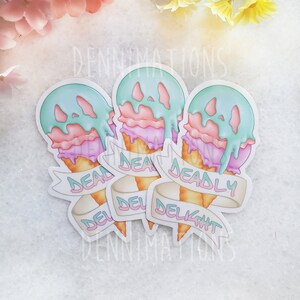 May include: Three pastel-colored ice cream cone stickers with the text "Deadly Delight" on a white background. The ice cream cones are dripping with melted ice cream and have a spooky face.