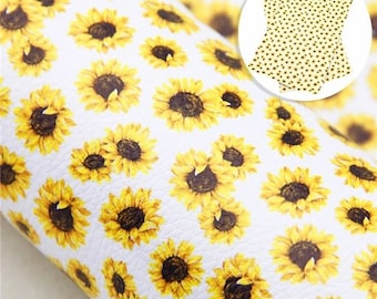 May include: White faux leather sheet with a repeating pattern of yellow sunflowers.