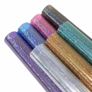 May include: Six rolls of iridescent vinyl with a holographic finish in various colors, including purple, blue, silver, gold, pink, and teal.