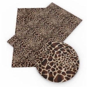 May include: Brown and tan giraffe print fabric with a textured surface.