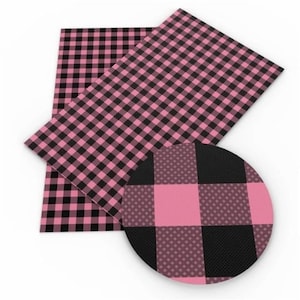 May include: Pink and black buffalo plaid fabric. The fabric has a small checkered pattern.