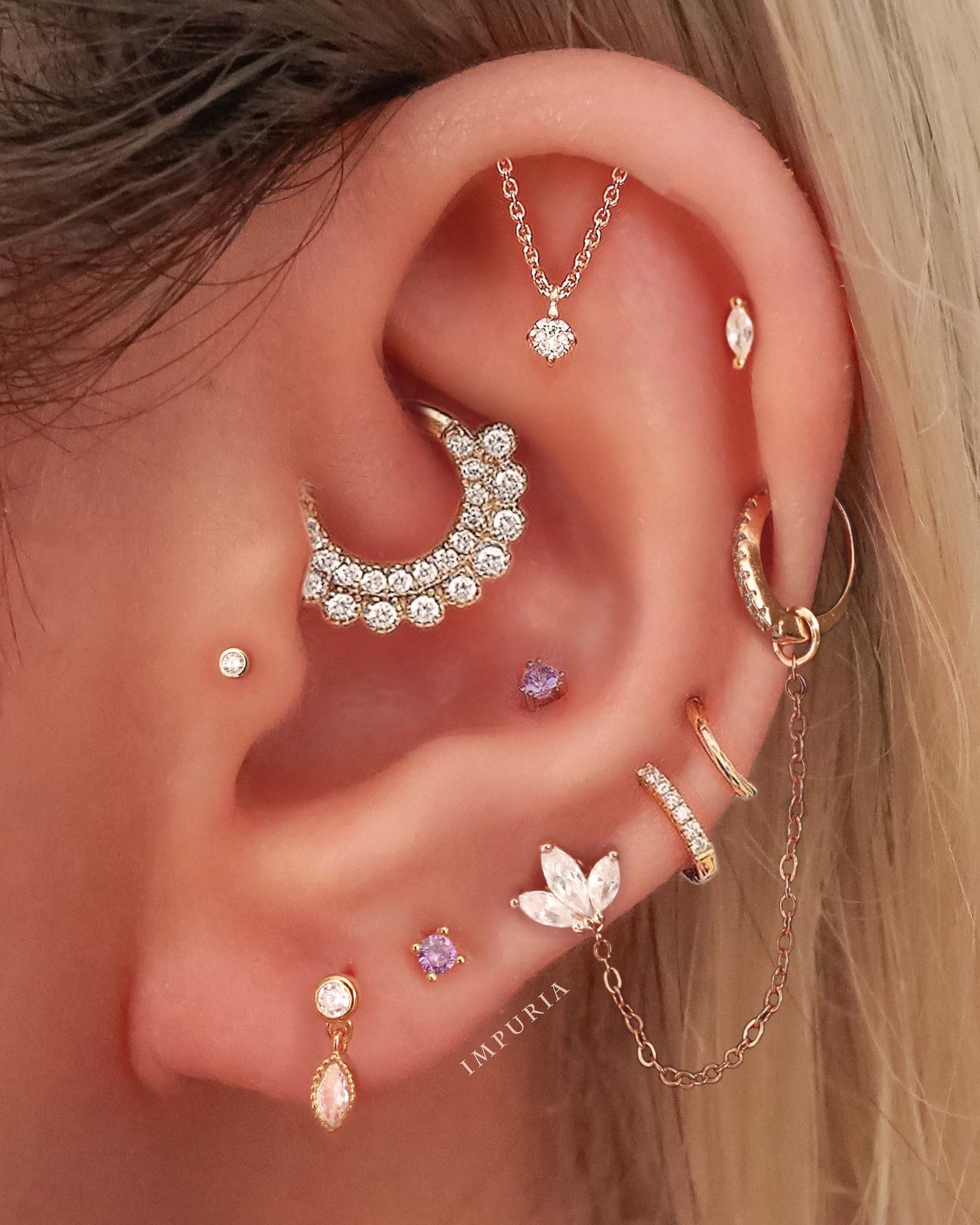 Helix piercing: pain, healing, jewelry - obsidian piercing