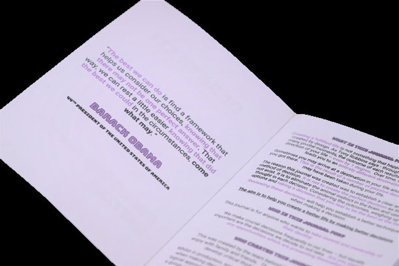 May include: A close-up of a book with a purple background. The book features a quote from Barack Obama, the 44th President of the United States of America. The quote reads, "The best we can do is find a framework that helps us consider our choices, knowing that there may not be one perfect answer. That way, we can rest a little easier knowing that did the best we could in the circumstances, come what may."