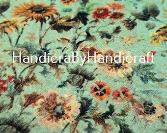 May include: Floral fabric with a light teal background and a pattern of sunflowers, red and orange flowers, and dark green leaves. The text "HandicraByHandicraft" is visible. The fabric has a vintage, botanical theme.