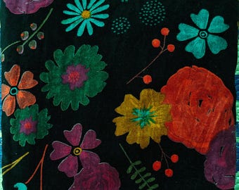 May include: Black fabric with a vibrant floral pattern. The design features large, colorful flowers in shades of red, purple, green, yellow, and teal. The flowers are set against a black background with green leaves and stems.