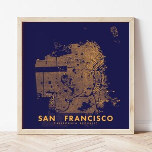 May include: A gold-colored map of San Francisco on a dark blue background. The map shows the city's streets and neighborhoods. The text "SAN FRANCISCO" and "CALIFORNIA REPUBLIC" is printed below the map.