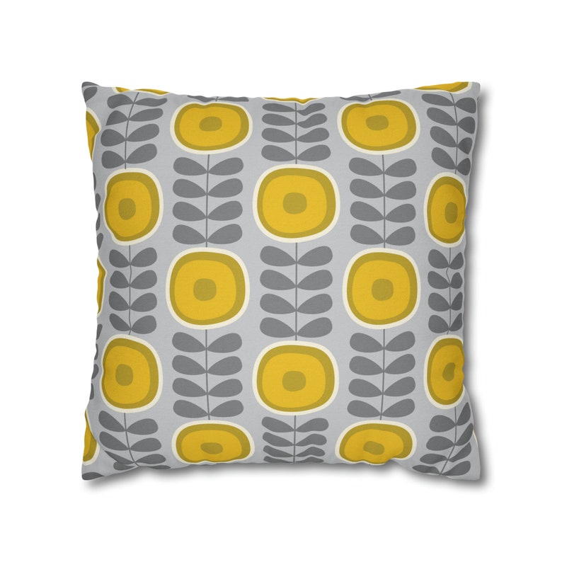 May include: A gray and yellow throw pillow with a repeating pattern of stylized flowers and leaves.