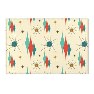 May include: A retro-style patterned fabric with a repeating design of teal and red diamonds, gold stars, and stylized atomic-age symbols on a cream background.