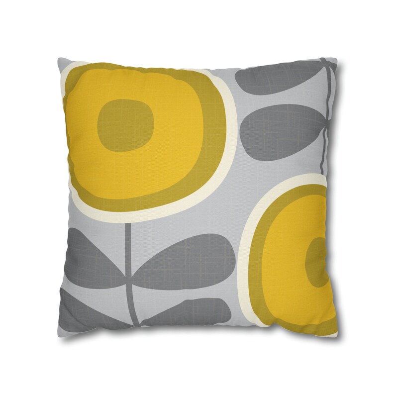 May include: A gray and yellow throw pillow with a floral pattern. The pillow features large yellow circles with smaller yellow circles inside, and gray leaves.