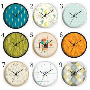 May include: Nine different clock designs with various mid-century modern patterns. The clocks are all round and have black hands. The patterns include geometric shapes, stars, and abstract designs. The clocks are all white with black outlines.
