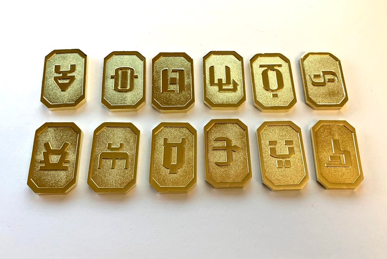 Set of 12 Gold-Tone Battlestar Galactica Cubit Currency