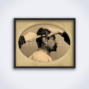 May include: A black and white photograph of a man with a measuring tool on his head. Two hands are holding the tool in place.