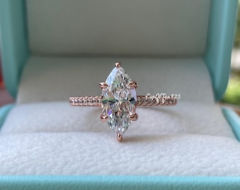 Pierścionek zaręczynowy z diamentem o szlifie markiza. Pierścionek zaręczynowy z diamentem CZ o szlifie markiza o masie 1,5 ct, wykonany ze srebra próby 925 z rodem, 14-karatowego żółtego złota i różowego złota.