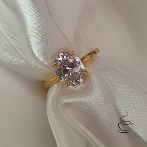 2.5CT oval cut simulated diamond engagement ring in yellow gold vermeil.