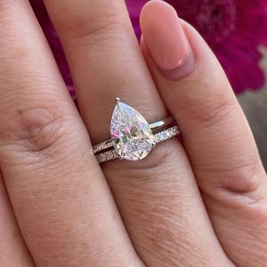 Sterling Silver 925 bridal set with 3.5CT CZ pear shaped solitaire and half eternity moissanite band