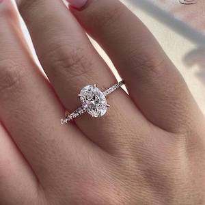 The Stella. Hidden Halo. Rose gold over Sterling Silver 925 engagement ring with 2.2CT oval cut the finest 6A CZ simulated diamonds