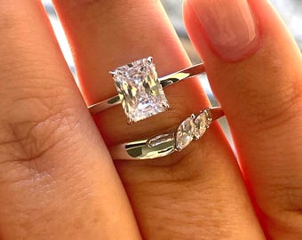 2 carat radiant cut moissanite engagement ring set. Sterling silver 925 bridal ring set with 2CT solitare with hidden halo and curved band.