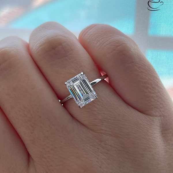 New In! The Grace. Hidden halo. Sterling Silver 925 engagement ring with 3CT emerald cut CZ simulated diamond and hidden halo.