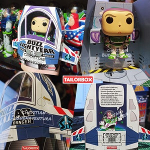 May include: A Buzz Lightyear Funko Pop figure in its original packaging. The box is white and blue with the words "Buzz Lightyear" and "Space Ranger" printed on it. The figure is in a green and white spacesuit.
