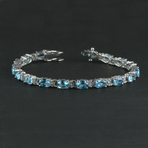 handmade one of a kind Swiss Blue Topaz and silver tennis bracelet