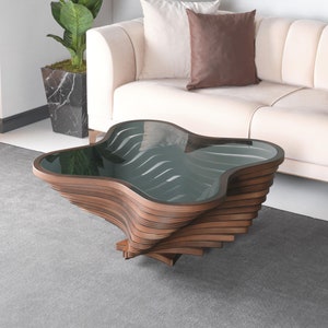 May include: A coffee table featuring a dark brown, multi-layered wooden base with a swirling, organic shape. The top surface consists of a smooth, dark-tinted glass pane that follows the irregular, curved contour of the wooden structure below.