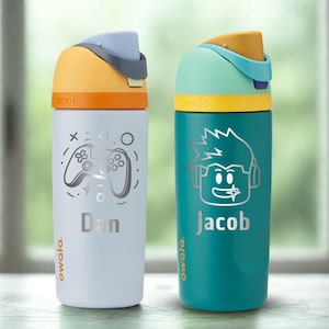 May include: Two insulated water bottles. One is light blue with a controller graphic and the name "Dan". The other is teal with a character graphic and the name "Jacob". Both have colorful lids.